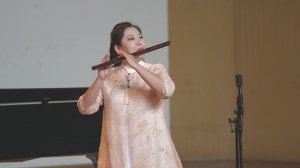 特别是首创竹笛“循环换气”演奏技术